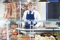 Portrait Of Butcher Standing Behind Counter Royalty Free Stock Photo