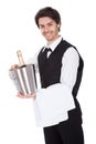 Portrait of a butler with bottle of champagne
