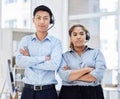 Portrait of call center colleagues. Business People working in customer service wearing headsets, arms crossed.Smiling Royalty Free Stock Photo