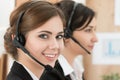 Portrait of call center worker accompanied by her team Royalty Free Stock Photo