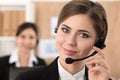 Portrait of call center worker accompanied by her team Royalty Free Stock Photo