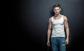 Portrait of a calm, handsome young man posing on a black background Royalty Free Stock Photo