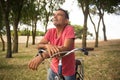 Portrait of calm mature man riding bicycle