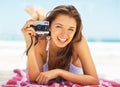 Portrait, camera and a woman tourist on the beach during summer for a holiday or luxury vacation. Ocean, bikini and Royalty Free Stock Photo