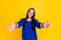 Portrait of candid young smiling lady wearing blue pullover open arms welcome you come here for hugs isolated on yellow Royalty Free Stock Photo