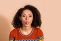 Portrait of carefree funny girlish girl with wavy hairstyle dressed ornament t-shirt show togue isolated on pastel color Royalty Free Stock Photo