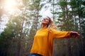 Beautiful happy blonde young woman dancing in forest Royalty Free Stock Photo