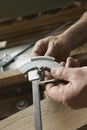 Portrait of Carpenter Adjusting Calipers