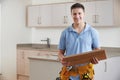 Portrait Of Carpenter Installing Fitted Kitchen Royalty Free Stock Photo