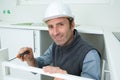 Portrait carpenter installing fitted kitchen Royalty Free Stock Photo