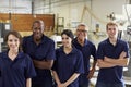 Portrait Of Carpenters In Busy Woodworking Factory