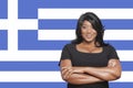 Portrait of casual mixed race woman against Greek flag Royalty Free Stock Photo