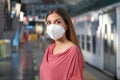 Portrait of casual woman waiting subway metro train with KN95 FFP2 protective mask at underground station