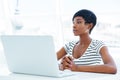 Portrait of a casual young african businesswoman using laptop computer Royalty Free Stock Photo