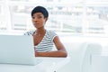 Portrait of a casual young african businesswoman using laptop computer Royalty Free Stock Photo