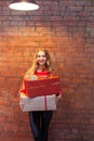 Portrait of casual young happy smiling woman hold gift box again Royalty Free Stock Photo