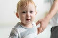 Portrait of Caucasian adorable baby boy kid smile, looking at camera. Cute little young toddler son feel happy while learn to walk Royalty Free Stock Photo