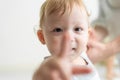 Portrait of Caucasian adorable baby boy kid smile, looking at camera. Cute little young toddler son feel happy while learn to walk Royalty Free Stock Photo