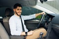 Portrait of caucasian bearded businessman driving car. cheerful man in his car looking camera. Royalty Free Stock Photo