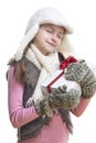 Portrait of Caucasian Blond Girl in Winter Clothing Holding White Giftbox Wrapped in Red Ribbon