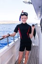 Portrait of caucasian boy in the diving suit with Royalty Free Stock Photo