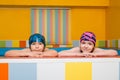 Portrait of Caucasian boy and girl in swimming pool Royalty Free Stock Photo