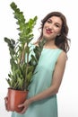 Portrait of Caucasian Brunette Woman with Zamioculcas Dollar Tree Royalty Free Stock Photo