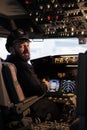 Portrait of caucasian captain using cockpit dashboard command Royalty Free Stock Photo
