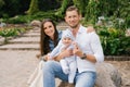 Portrait of a Caucasian family enjoying happy love, father and mother holding a cute little son in their arms, smiling, playing Royalty Free Stock Photo