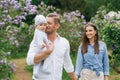 Portrait of a Caucasian family enjoying happy love, father and mother holding a cute little son in their arms, smiling, playing Royalty Free Stock Photo