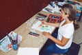 Caucasian woman artist drawing painting in art studio Royalty Free Stock Photo