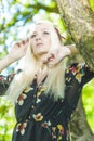 portrait of Caucasian Female Blond Woman in Sprong Forest Relaxing Royalty Free Stock Photo