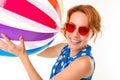 Cheerful woman with fair red hair holds a ball, picture isolated on white background Royalty Free Stock Photo