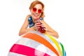 Cheerful woman with fair red hair holds a ball, picture isolated on white background Royalty Free Stock Photo