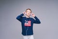 Portrait caucasian guy teenager listens to music with headphones in blue Royalty Free Stock Photo