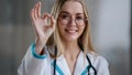 Portrait caucasian happy successful doctor practitioner specialist therapist nurse medical worker woman in glasses Royalty Free Stock Photo