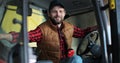 Portrait of caucasian male farmer in cap sitting in tractor with open door and smiling to camera. Agriculture farming. Royalty Free Stock Photo