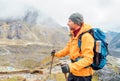 Portrait of caucasian man with backpack and trekking poles in Makalu Barun Park route near Khare. Mera peak climbing