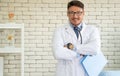 Portrait Caucasian man doctor standing with arms crossed smile confident friendly Royalty Free Stock Photo