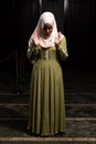 Portrait of a Caucasian muslim woman wearing the Islamic Long Hijab Khimar inside a mosque