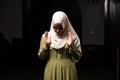 Portrait of a Caucasian muslim woman wearing the Islamic Long Hijab Khimar inside a mosque