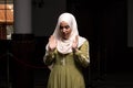 Portrait of a Caucasian muslim woman wearing the Islamic Long Hijab Khimar inside a mosque