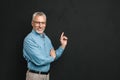 Portrait of caucasian retired man 60s with grey hair and beard i