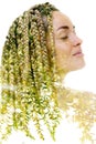 A portrait of a caucasian woman combined with an image of green leaves in a double exposure technique. Royalty Free Stock Photo