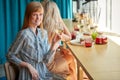 Portrait of caucasian woman with glass of white wine in cafe or restaurant.