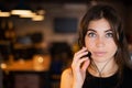 Portrait of a Caucasian woman wearing a headset with a microphone. Female hotline employee Royalty Free Stock Photo