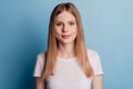 Portrait of charming adorable positive cute woman wear white t-shirt isolated on blue color background