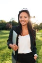 Portrait of charming asian business woman, standing with hand in