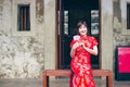 Portrait charming beautiful asian woman wear cheongsam dress up open the red envelope with money, in the Chinese New Year. Royalty Free Stock Photo