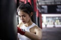 Portrait charming beautiful boxer woman: Attractive girl is practicing boxing. Gorgeous girl is punching target. Pretty girl love Royalty Free Stock Photo